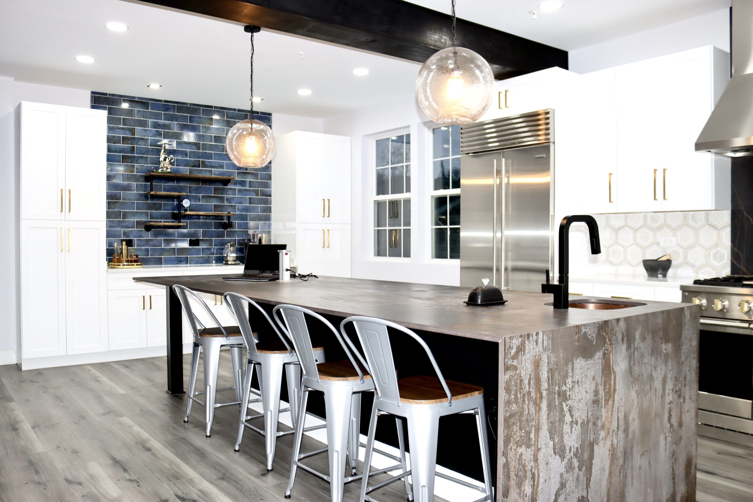 Kitchen island with Dekton Trillium waterfall countertop ends in Accokeek Maryland by MSH Signature