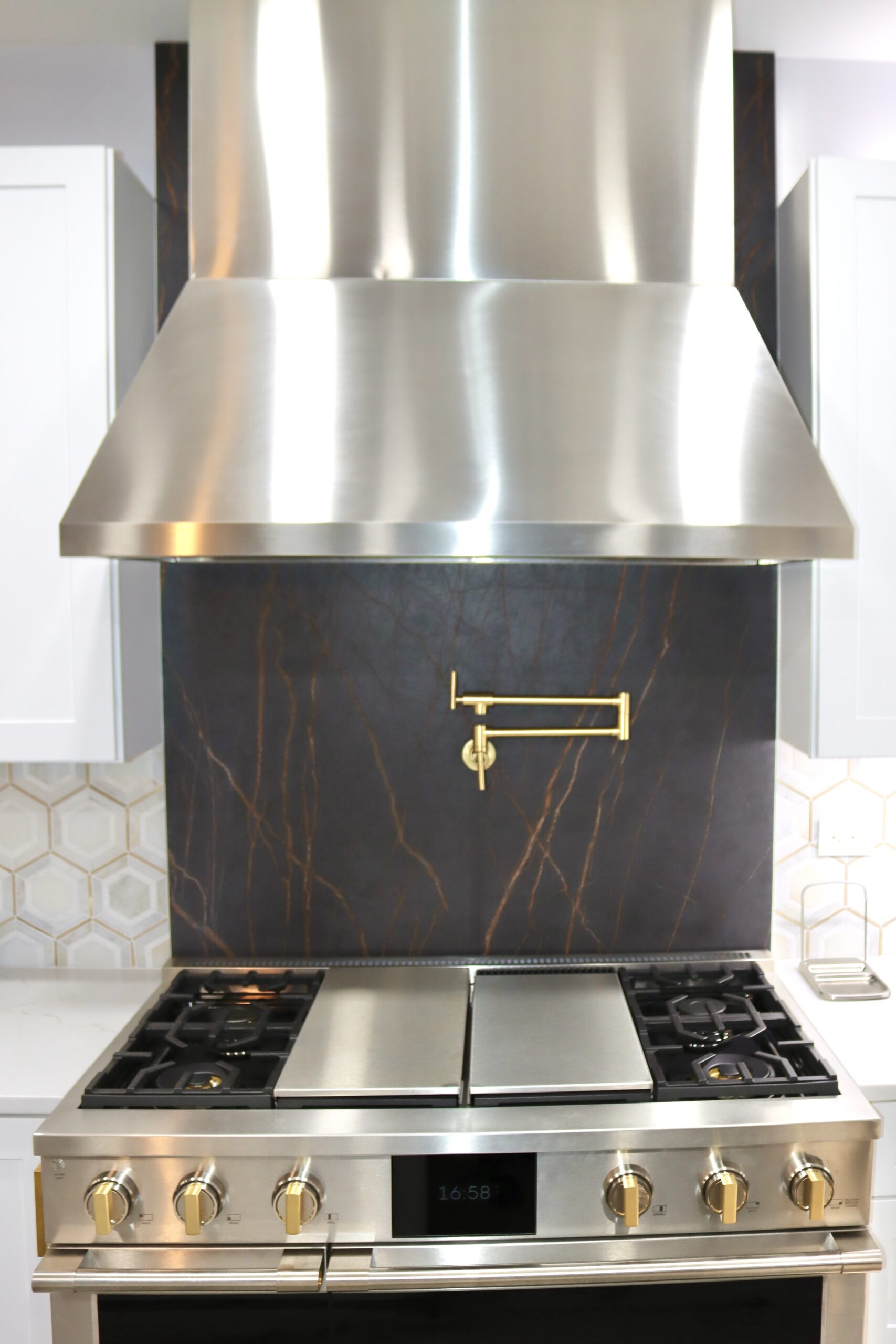 Gold pot filler with Dekton Laurent-style backsplash and premium cooking wall in Accokeek, MD