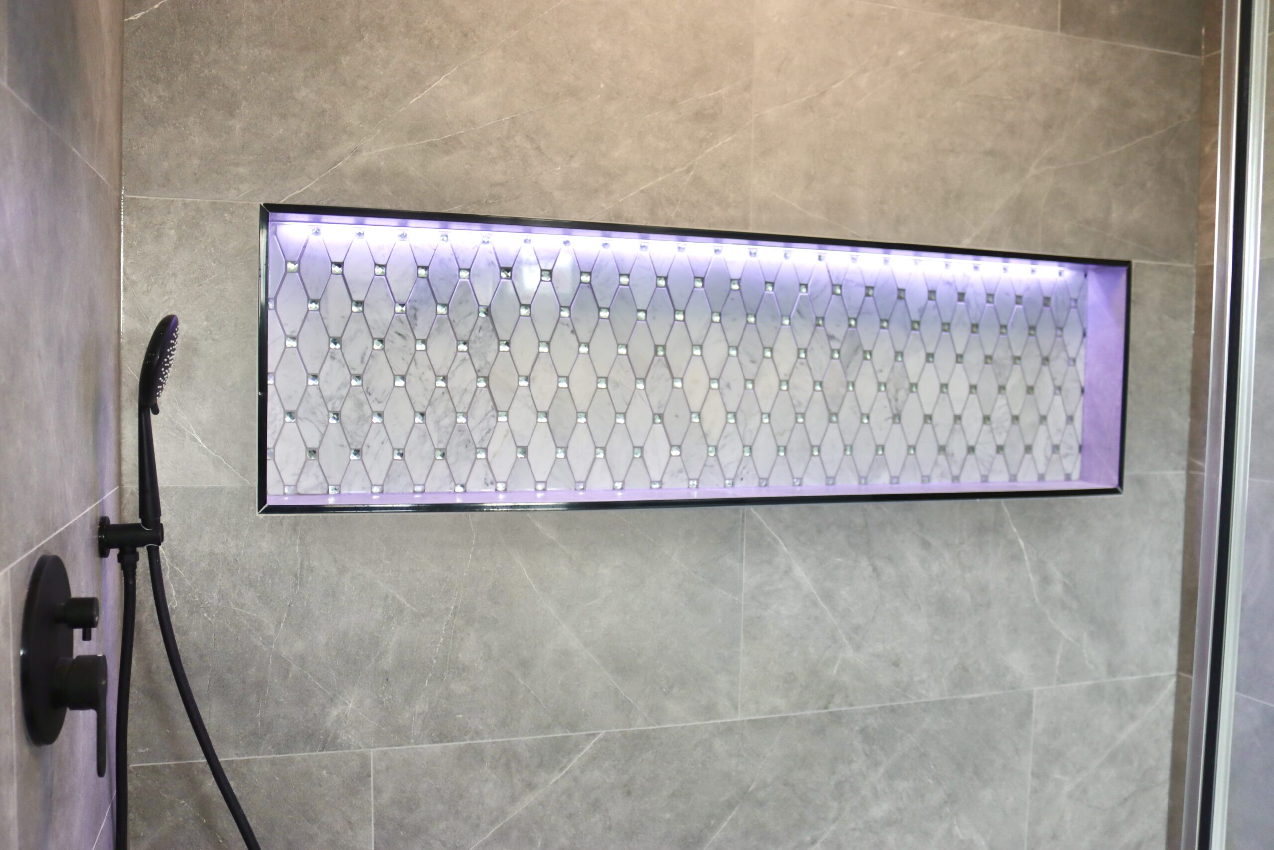 Large LED shower niche in Brandywine Maryland bathroom remodel.