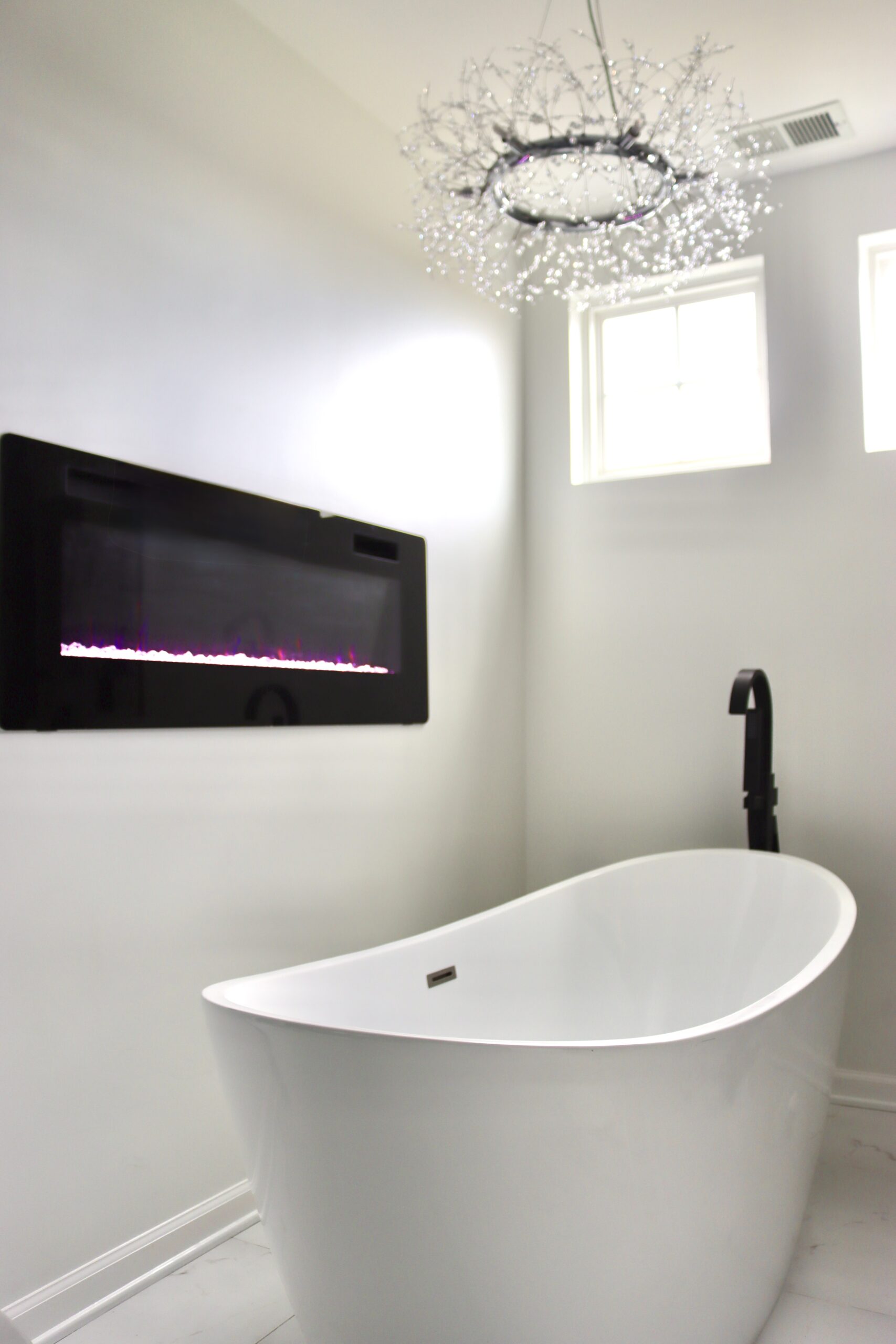 Bathroom fireplace with freestanding tub in Fort Washington MD luxury primary suite