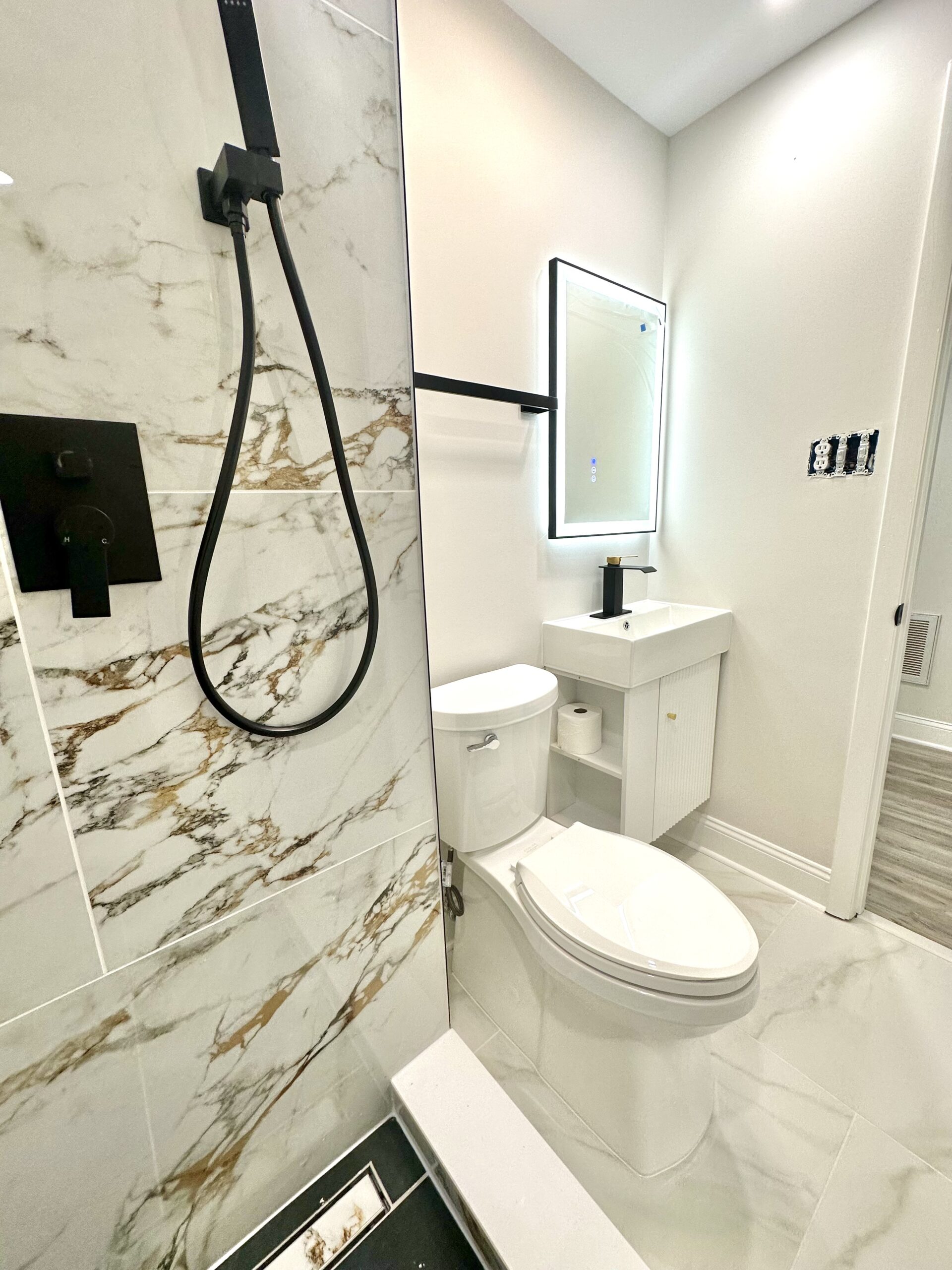 Large-format tile shower in Brandywine Maryland with grab-bar-friendly walls.