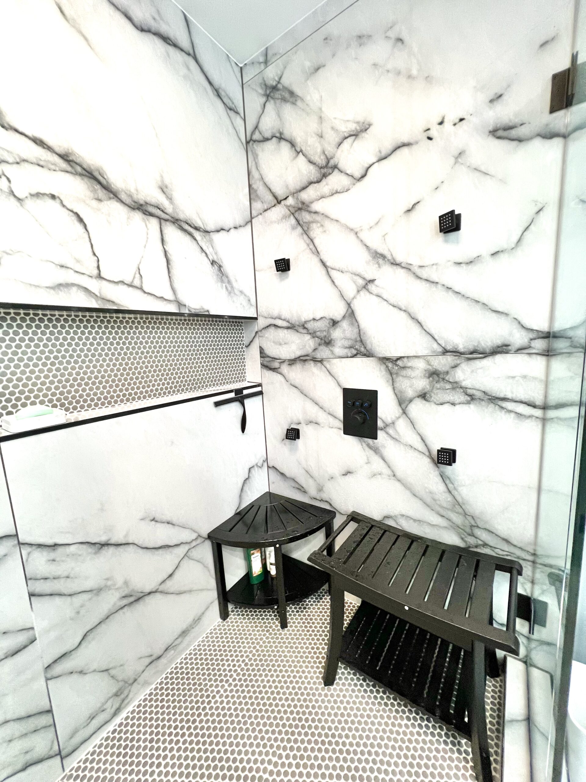 Glass shower enclosure with bench and dual niches in Upper Marlboro MD