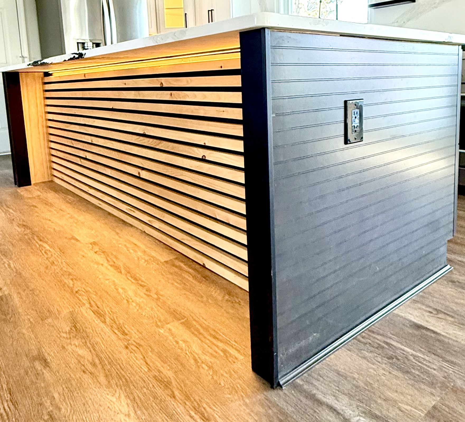 Kitchen island custom slat wood LED detail in Fort Washington Maryland by MSH Signature