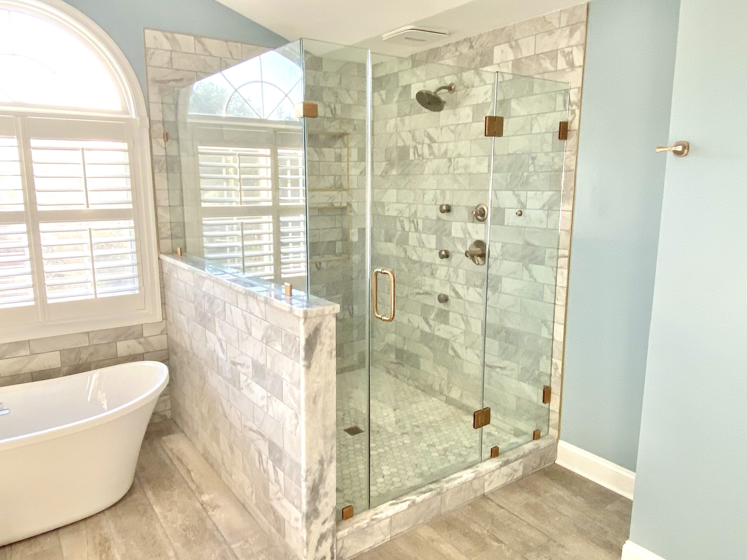 Luxury glass shower enclosure with body spray system in Upper Marlboro MD