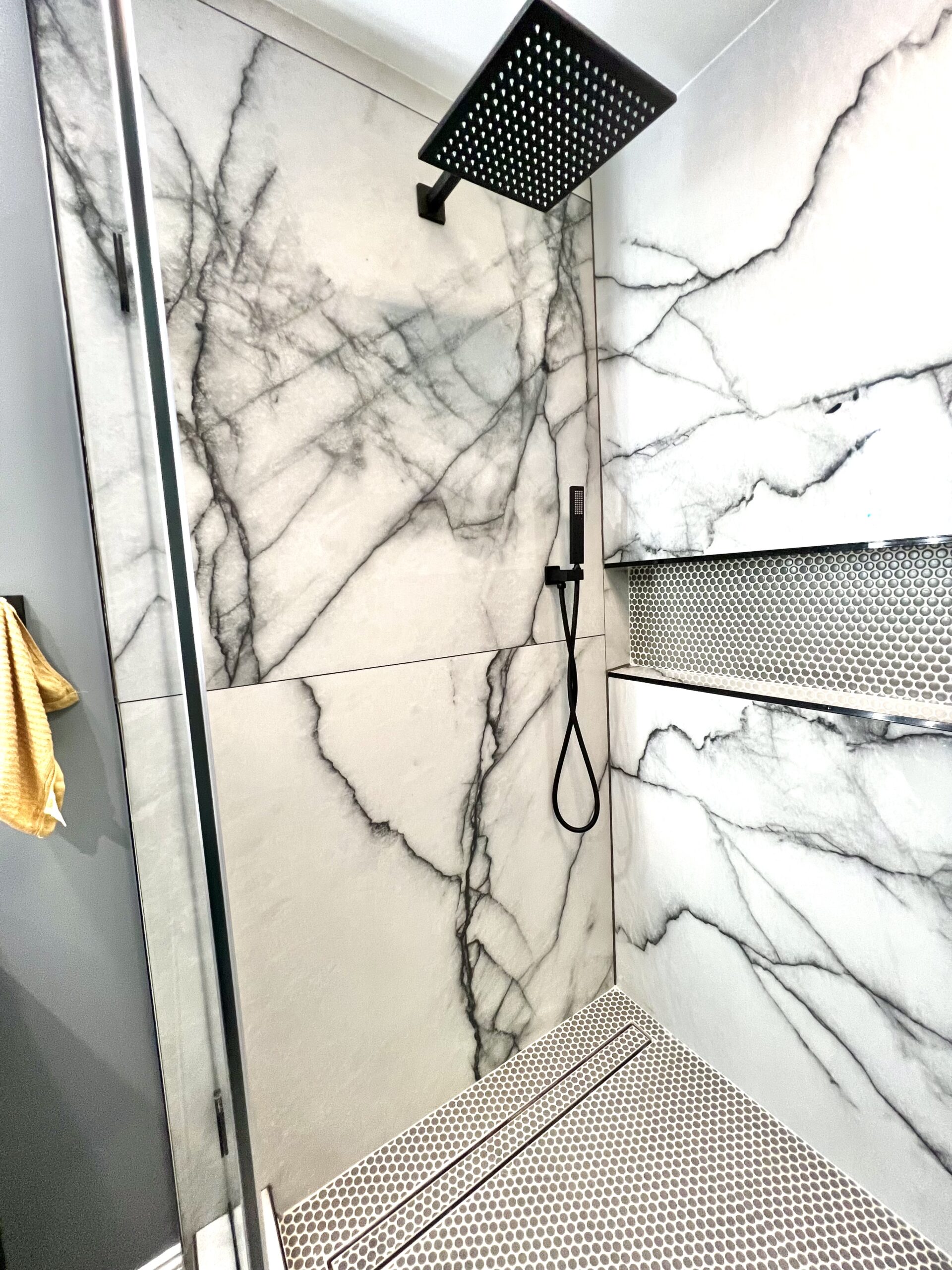 Walk-in glass shower enclosure with rain head in Upper Marlboro Maryland