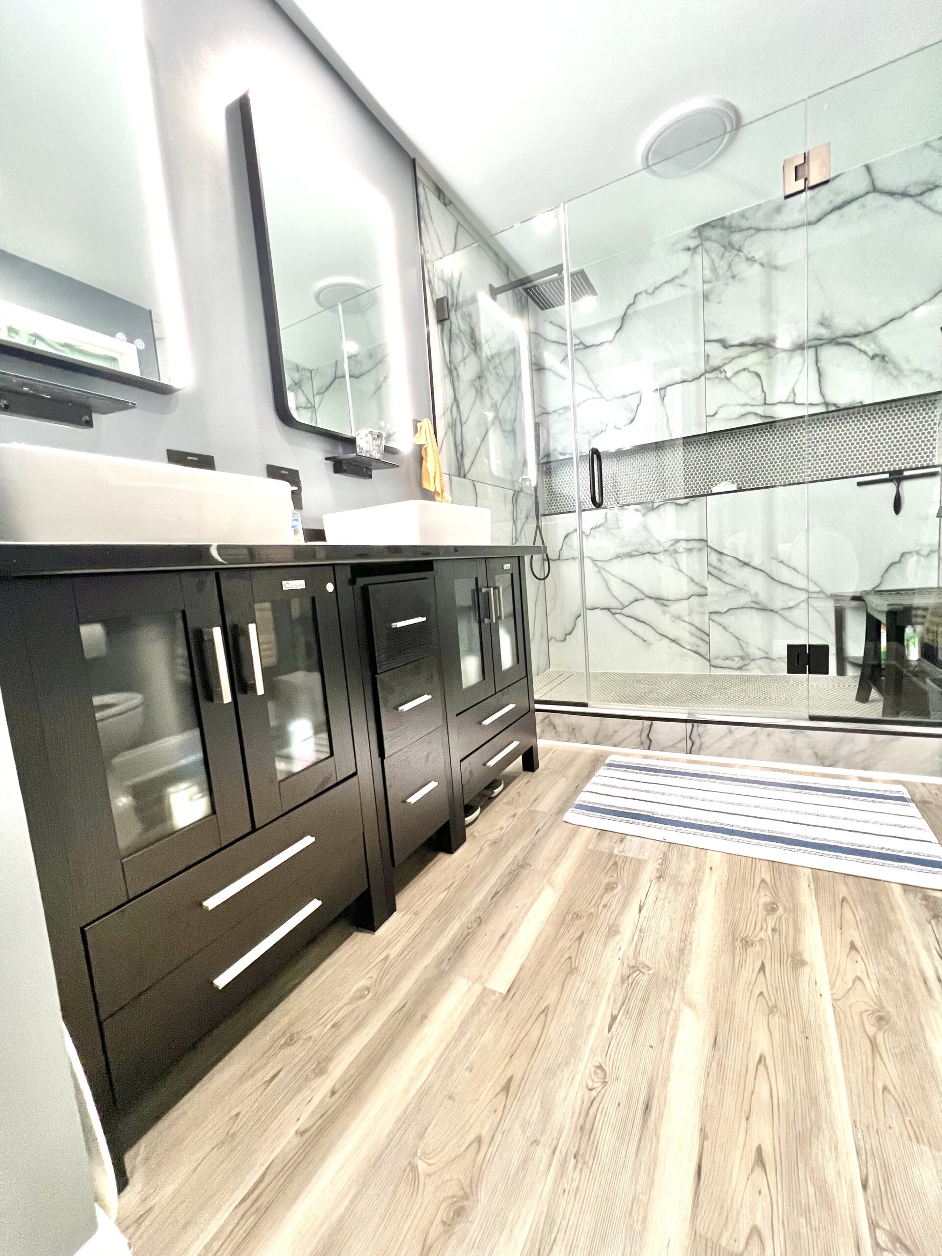 Zero-threshold glass shower enclosure in Upper Marlboro MD with modern drainage