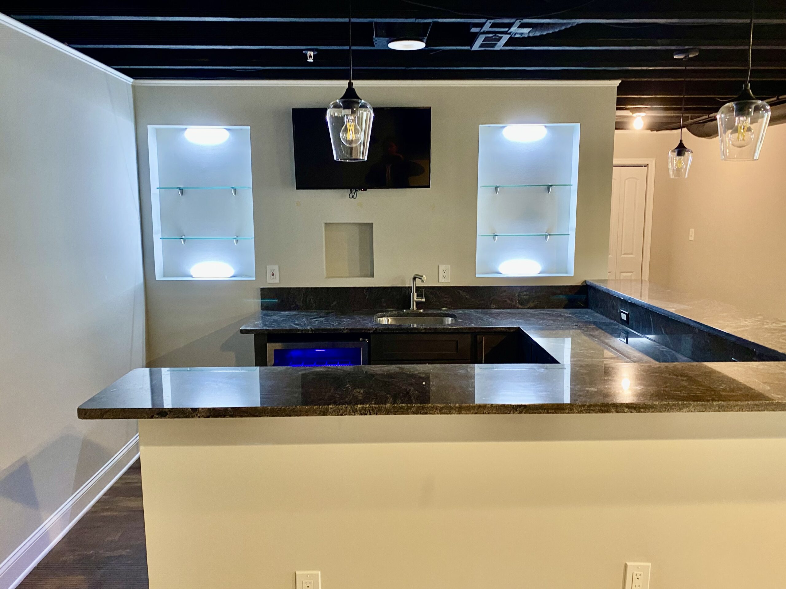 Luxury finished basement bar in Southern Maryland by MSH Signature