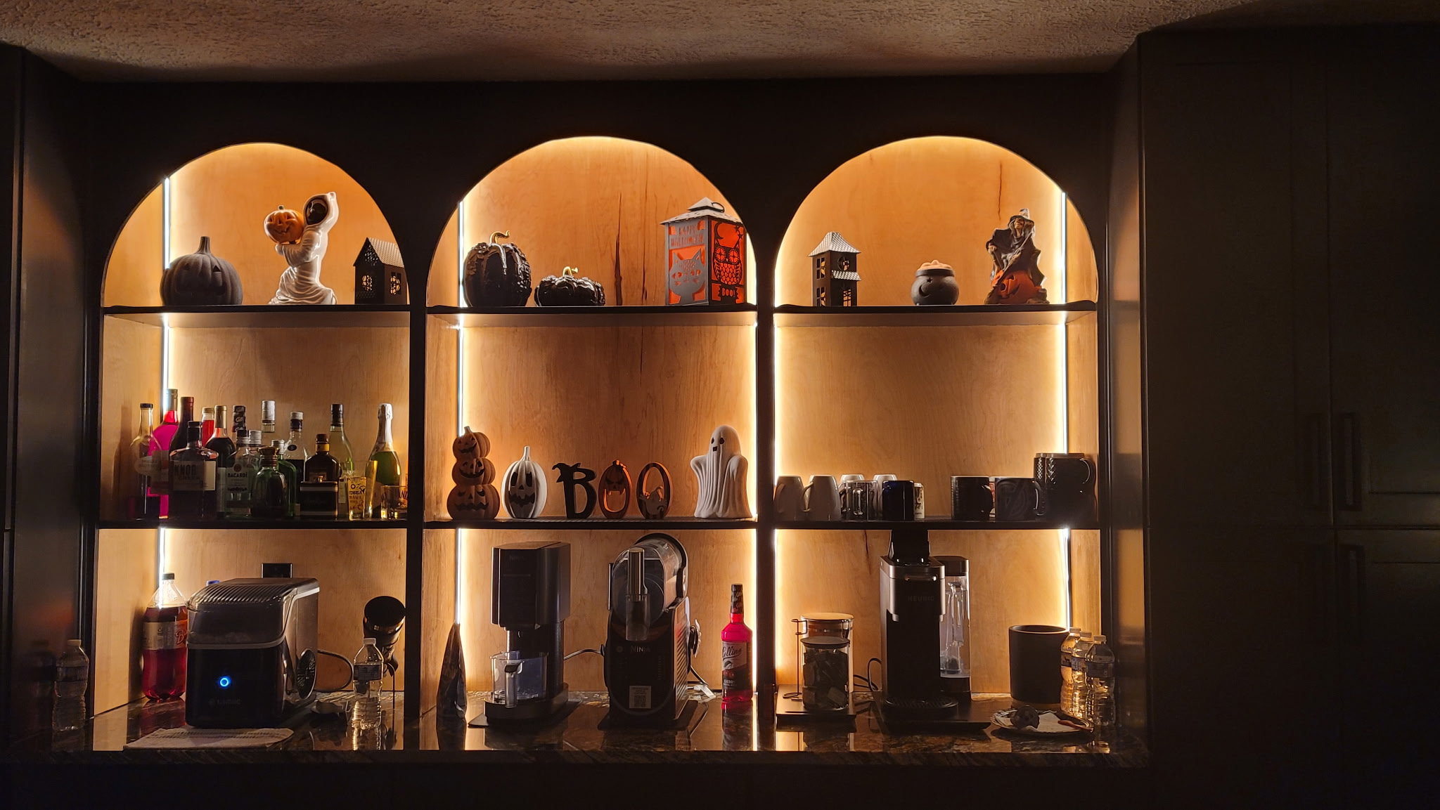 Custom arched curio shelving with LED lighting in Fort Washington Maryland by MSH Signature